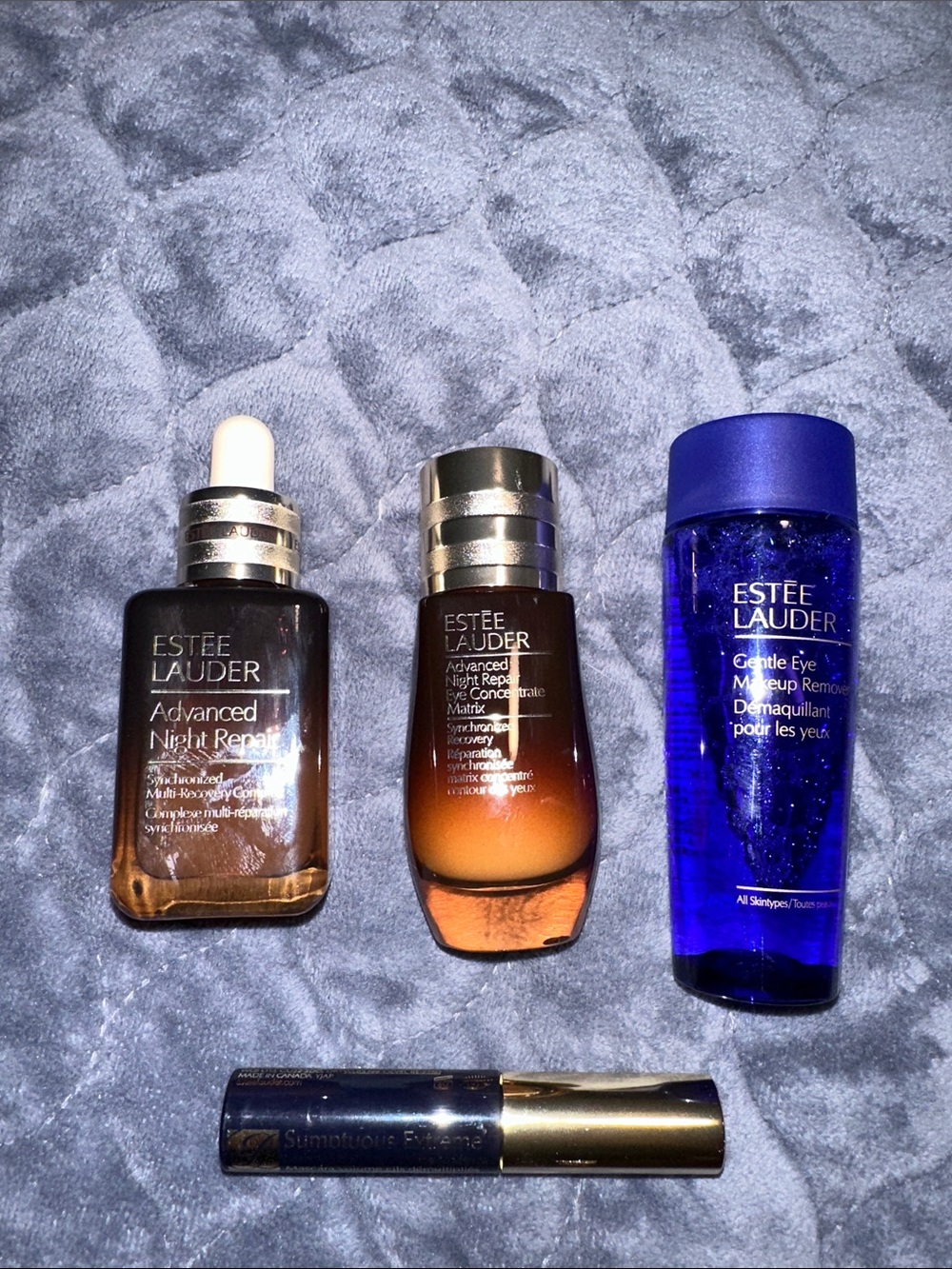 Estee Lauder skincare set — amber, blue, gold